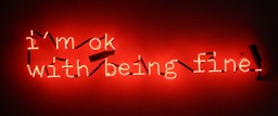 Neon red text in a short, serif typewriter font reads, &quot;I'm ok with being fine&quot; set against a black background.