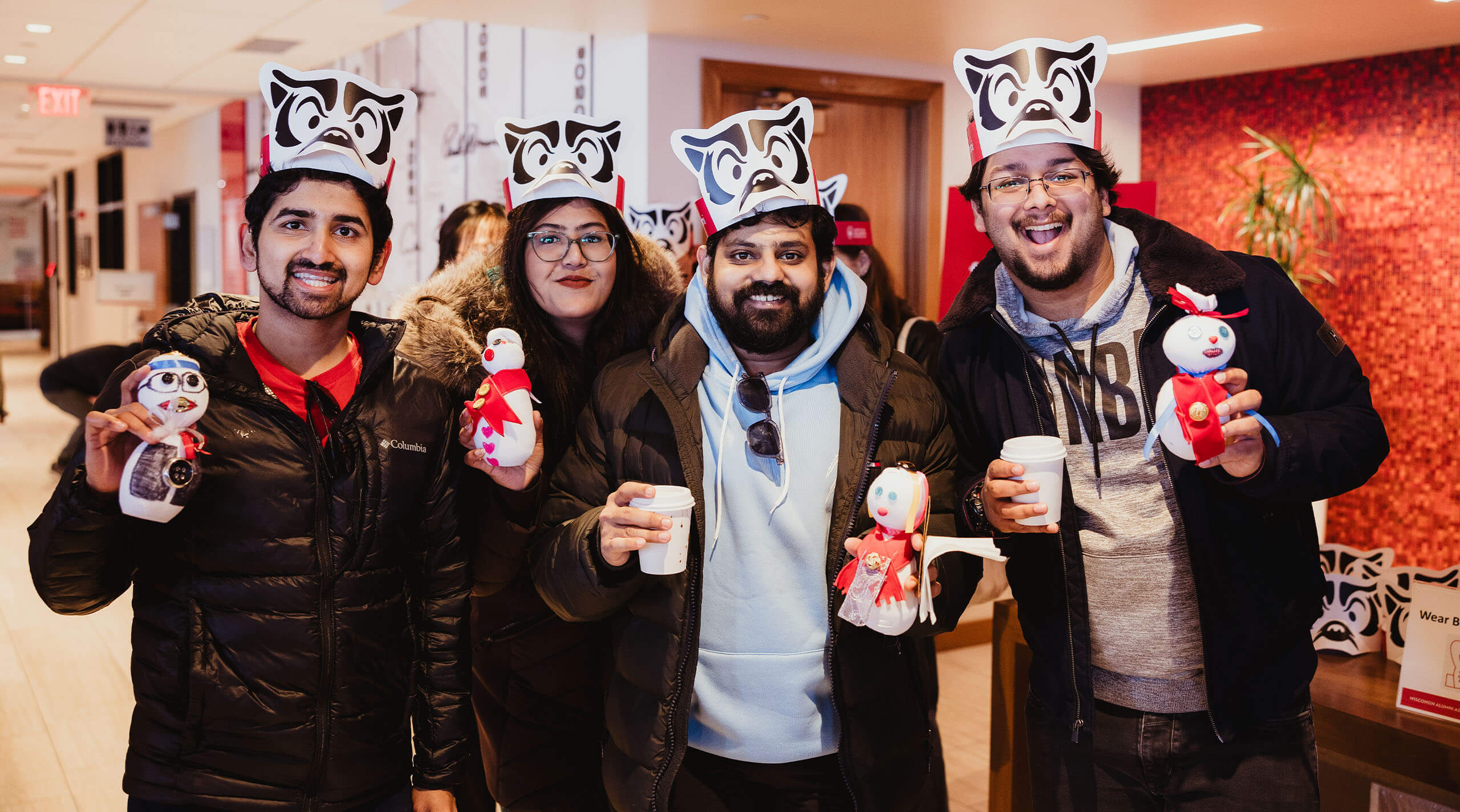 People pose with swag from Winter Carnival