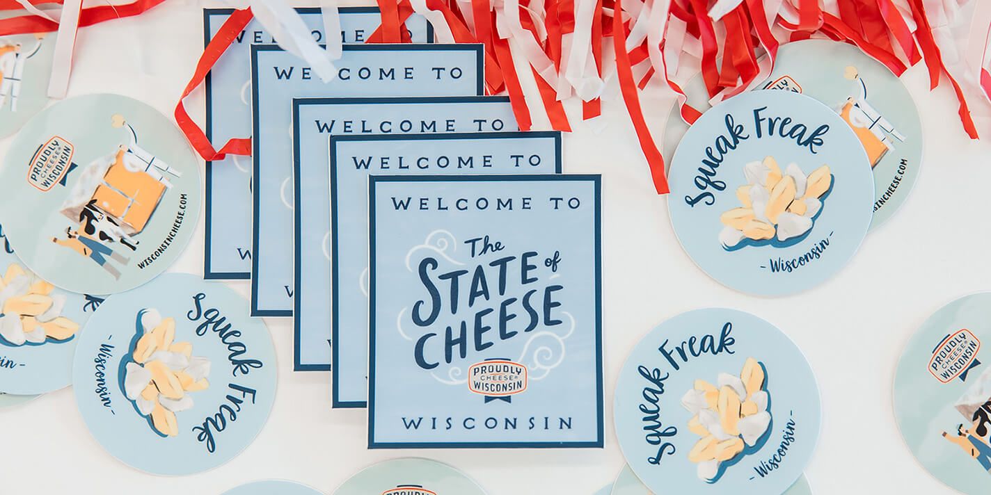 Top-view of a table with stickers about cheese