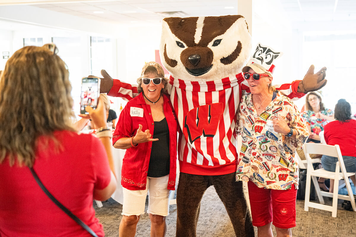 Alumni pose with Bucky at 175th State Tour stop in Waukesha.